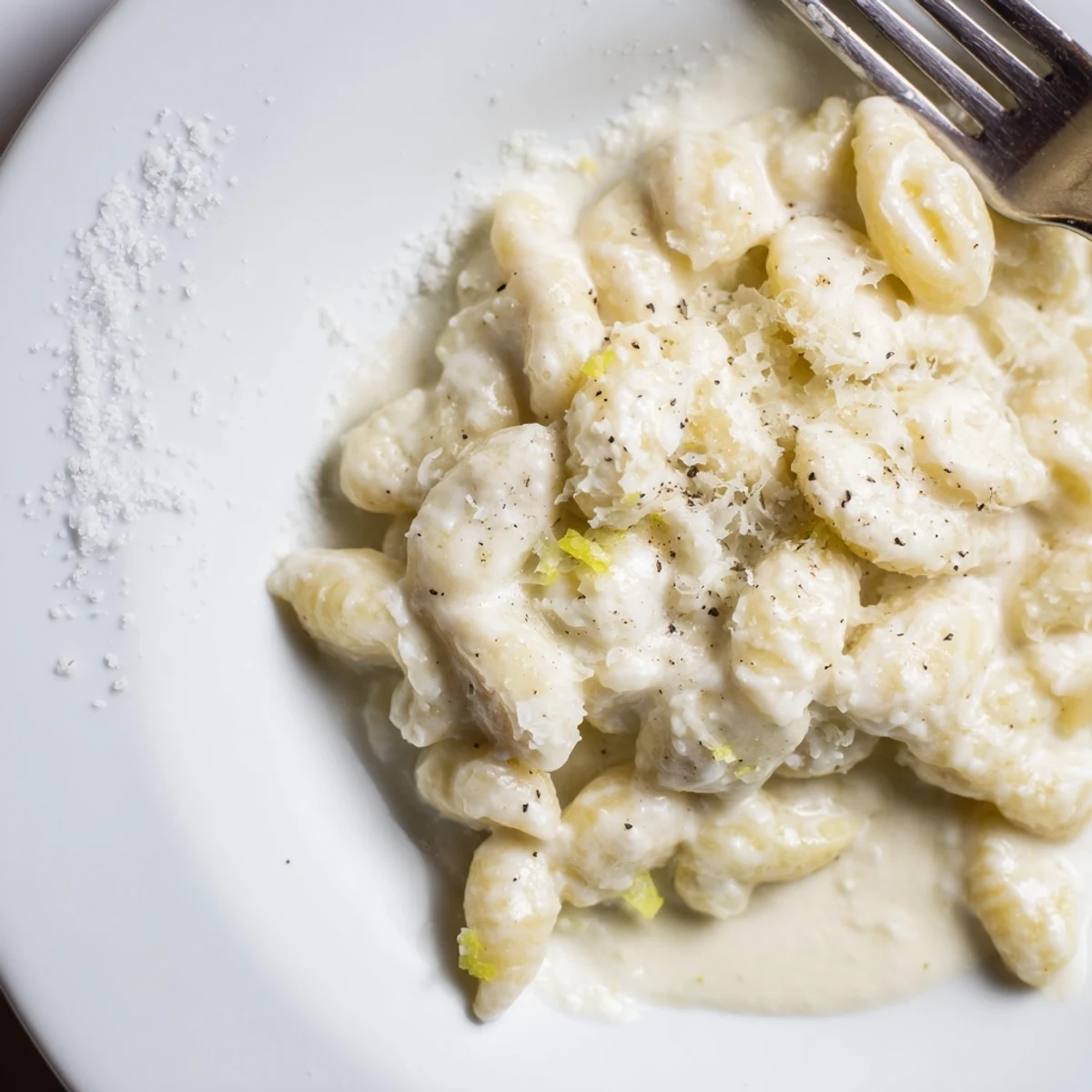 Creamy lemon ricotta pasta dish served with fresh arugula for added flavor.  
