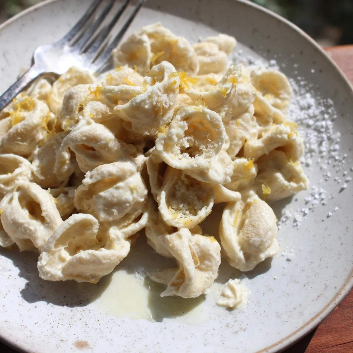 Zesty lemon ricotta pasta garnished with Parmesan for a delightful Italian twist.  