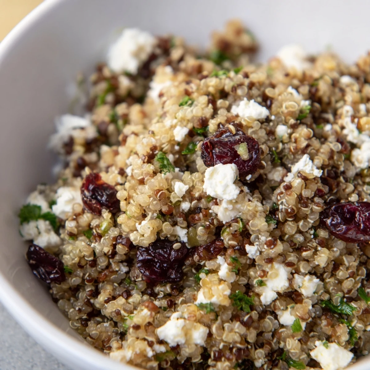 Vibrant quinoa salad with creamy feta and tart cranberries, perfect for healthy eating.