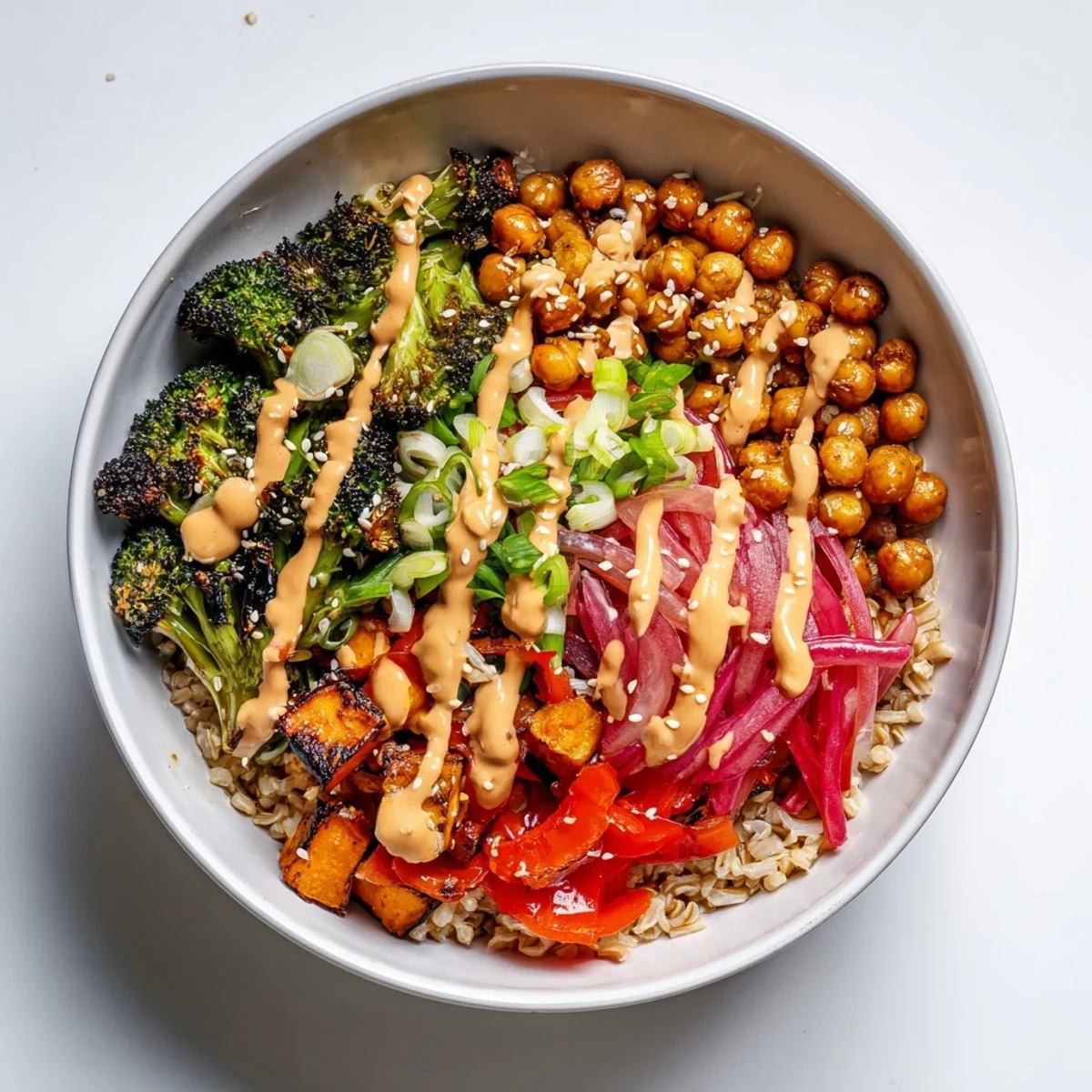 Vibrant Bold Sauce Drizzle Bowls topped with miso-butter sauce and roasted veggies.
