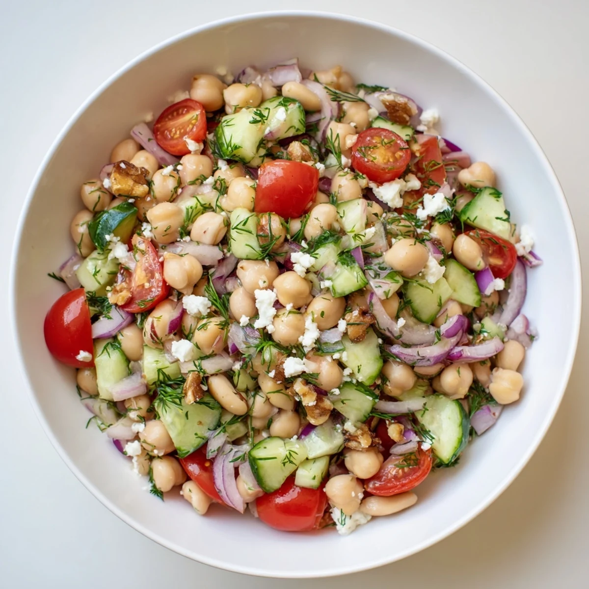 Vibrant, colorful Dense Bean Salad with Sleepy Girl Mocktail Dressing, ready to serve with optional feta.
