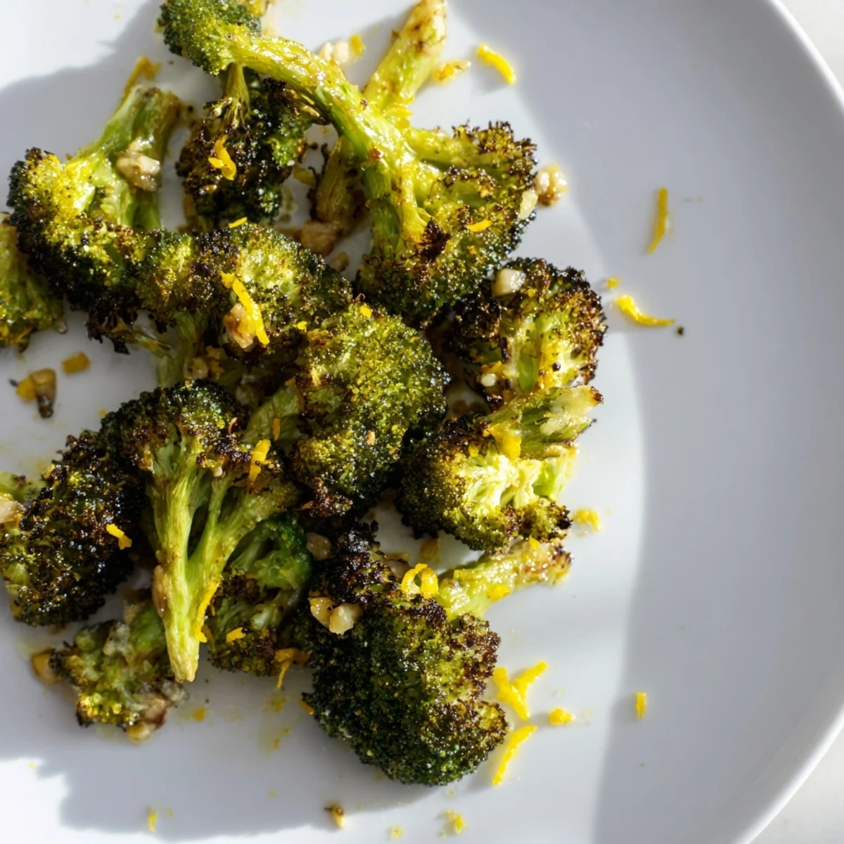 Golden-brown Lemon Garlic Roasted Broccoli glistens after roasting, ready to serve with a bright lemon aroma.