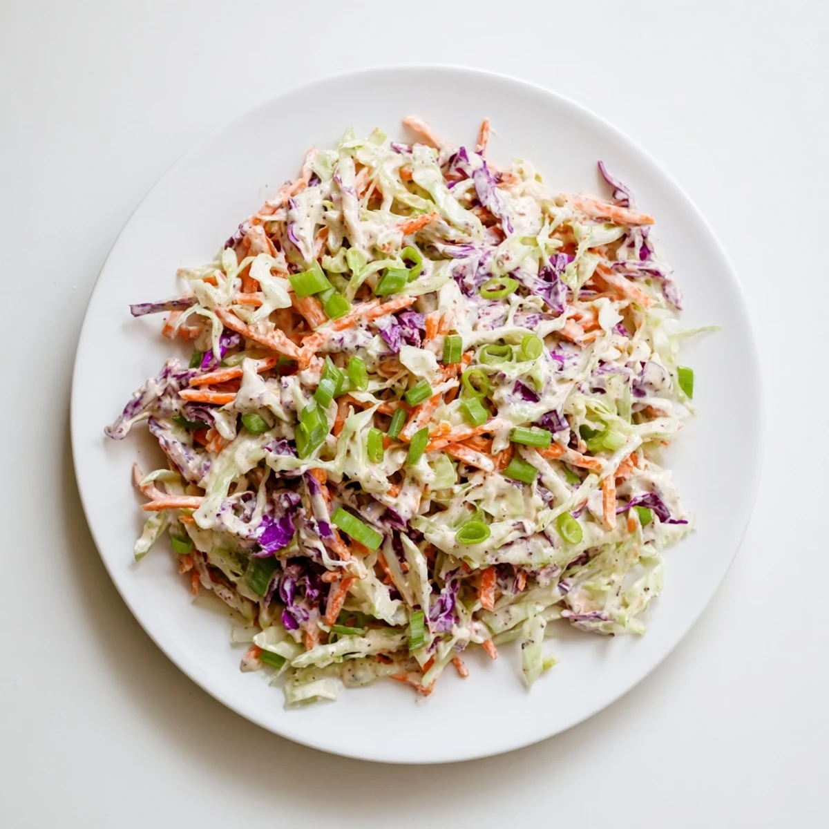 Fresh and vibrant Quick Coleslaw Salad, with colorful shredded cabbage and creamy dressing.
