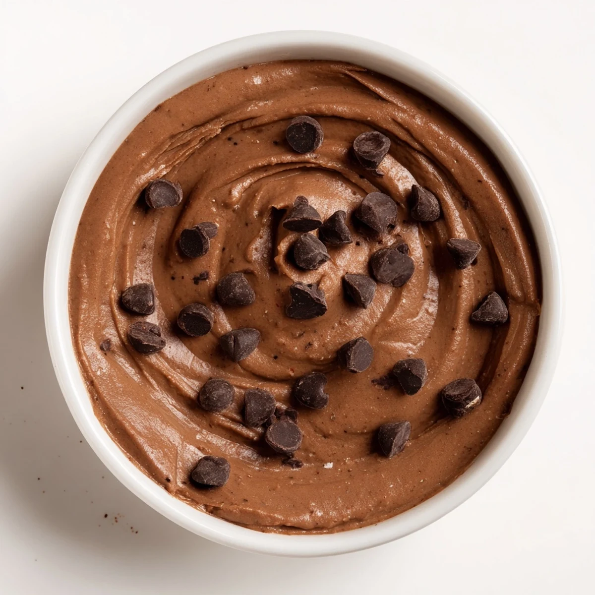 Smooth, rich chocolate hummus ready to be scooped up with pretzels for a satisfying snack.