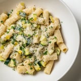 A steaming bowl of One-Pot Creamy Zucchini Ditalini, boasting tender zucchini and rich Parmesan flavor.