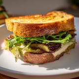 Golden-brown sourdough holds creamy Brie and sweet fig preserves in this delicious grilled cheese recipe.