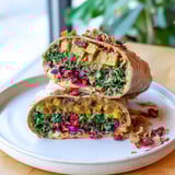 Delectable close-up of a Sweet Chili Tofu Crunch Wrap, showcasing the crunchy texture and layered fillings.