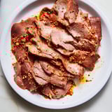 Vibrant photo of spiced Turkish Döner Meat, flavorful and cooked to juicy perfection, ready to enjoy.