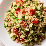 Text: This bright Bulgur Wheat Salad Tabbouleh features diced tomatoes and cucumbers, ready to be enjoyed.
