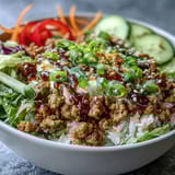 This close-up shows the vibrant layers of Spicy Bang Bang Turkey Rice Bowls, perfect for a quick weeknight dinner.