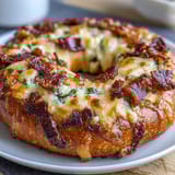 Jalapeño Cheddar Protein Bagels with melted cheese and spicy jalapeños baked golden and chewy.
