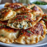 Warm, comforting vegetable pierogi bubbling in a pot of water.