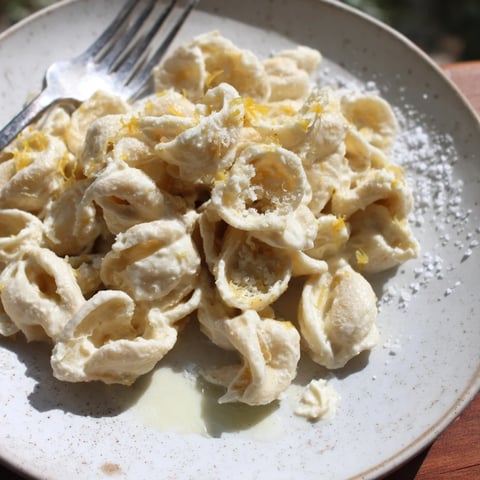 Zesty lemon ricotta pasta garnished with Parmesan for a delightful Italian twist.  