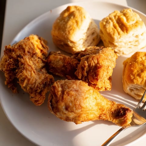 Crispy Southern Fried Chicken with buttermilk biscuits, a comforting family feast.  