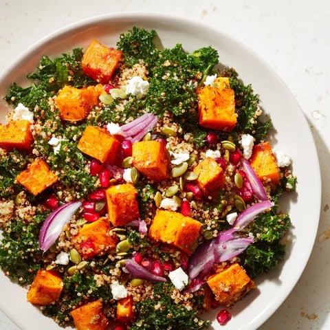 Vibrant Kale & Quinoa Salad: golden roasted sweet potatoes and a bright lemon dressing pictured beautifully.