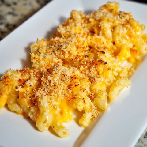 Golden-brown Baked Macaroni and Cheese, bubbling hot with a crispy panko topping, ready to serve.