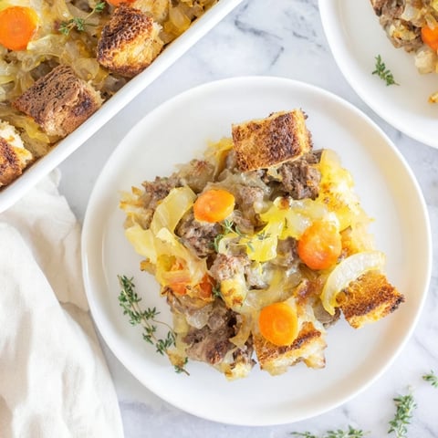 French Onion Pot Roast Casserole bubbling with melted Gruyère, a flavorful dinner everyone will love.
