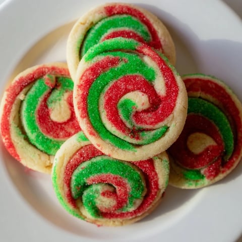 Swirled red and green in these Holiday Pinwheel Cookies, showcasing a festive cookie exchange dessert.