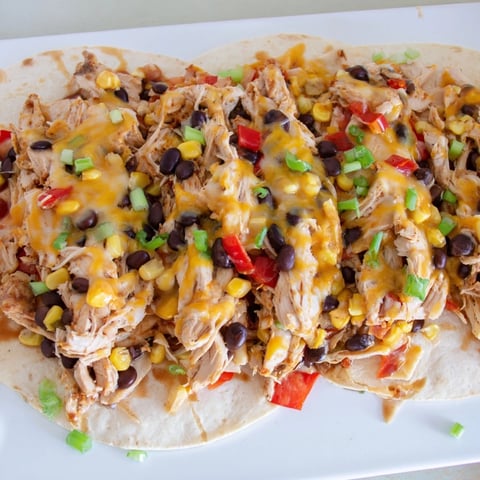 A warm, cheesy Taco Bell Copycat Chicken Bake with melted cheese and a golden crust is served.