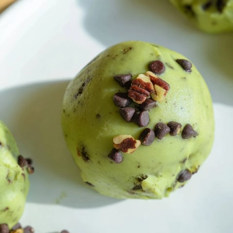 Matcha Gingerbread Cookie Dough Protein Bites, rolled into perfect spheres, ready for a healthy snack or breakfast.