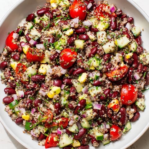 Vibrant Dense Bean Salad, piled high with fresh veggies and nutritious chia seeds.