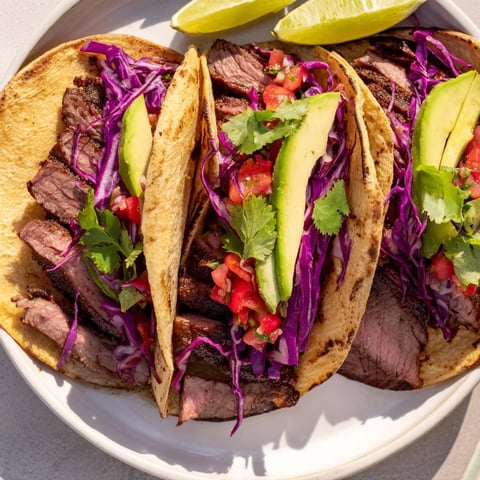 Coffee-Rubbed Steak Tacos are filled with juicy grilled steak and fresh, colorful toppings, a delicious meal.