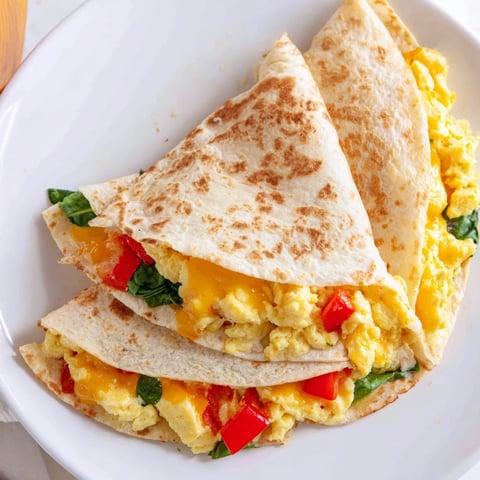 Golden-brown Breakfast Quesadilla Hack with cheese, eggs, and veggies, ready to enjoy at breakfast.