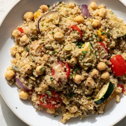 Fluffy quinoa power protein salad with colorful roasted vegetables and creamy dressing, delicious!