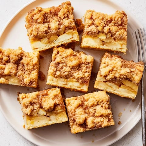 Buttery Ricotta Cinnamon Apple Pie Bars sit on display, ready to serve.
