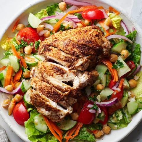 Perfectly roasted chicken salad, featuring a colorful array of fresh vegetables, ready to serve and enjoy.