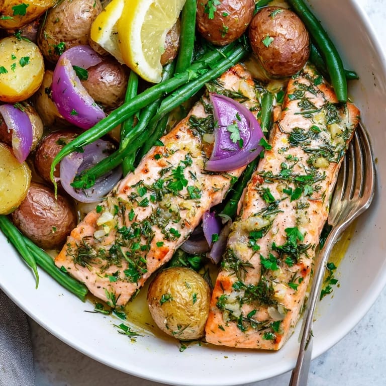 Savory Lemon Herb Salmon & Potato Sheet Pan, beautifully arranged with colorful seasonal produce.  