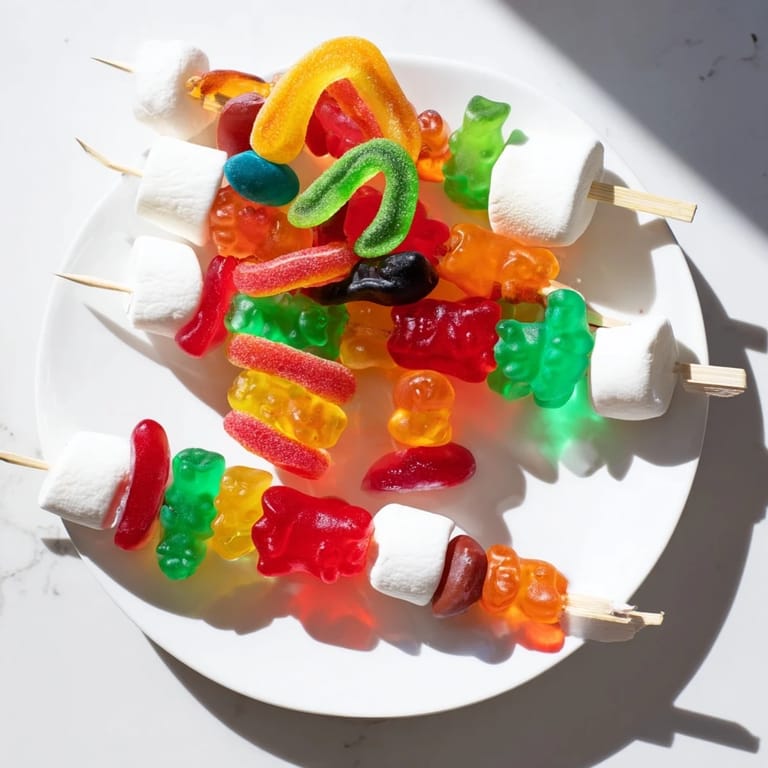 Party-ready Gummy Candy Kabobs, a fun dessert idea showcasing a rainbow of delicious, chewy candies.