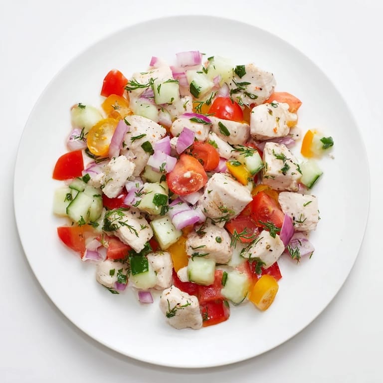 Close-up of a refreshing Cucumber and Chicken Clean Shaker with tender chicken and crisp cucumber pieces.