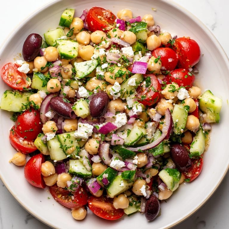 Imagine a refreshing bowl of flavorful Mediterranean Chickpea Salad, ready to eat in under fifteen minutes.