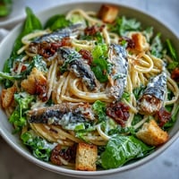 Vibrant Sardine Caesar Pasta Salad featuring tender pasta, flaky sardines, and crisp romaine.